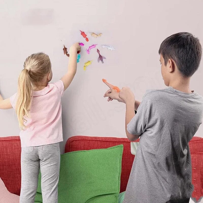 Jouets de doigt de dinosaure de fronde(10 pièces, couleurs aléatoires)